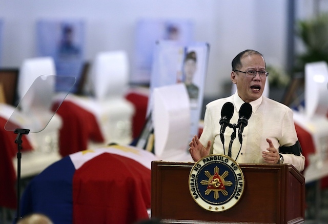 JUSTICE FOR SAF 44. With some coffins behind him, President Benigno Aquino III tries to comfort families of the elite cops killed in a clash with Moro rebels in Maguindanao, at necrological services in  Camp Bagong Diwa on January 30, 2015. Photo by  Dennis Sabangan/EPA  