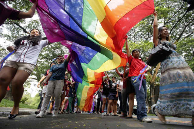 AWARENESS. Advocates say that education remains the greatest tool in fighting gender-based discrimination. Photo taken during the 2013 UP Pride March by Buena Bernal/Rappler  