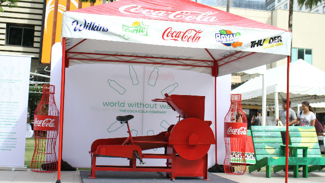 COKE TUNE-CYCLE. The Coke Tune-Cycle shreds PET bottles which will be used to create eco-bricks. 