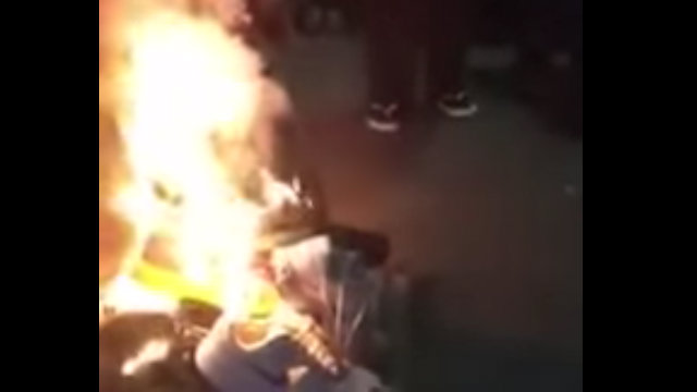 SWOOSH. Attendees at the Cebu Youth Fest burned Nike shoes in protest of their decision to drop Manny Pacquiao from its roster. Screenshot from Youtube 
