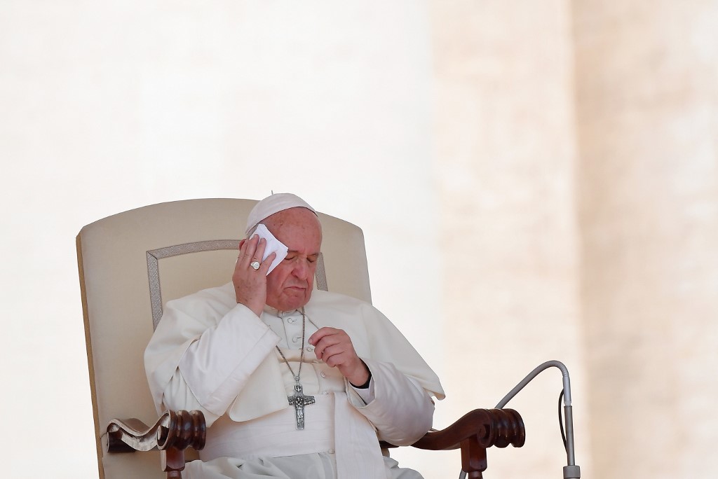 FEELING THE HEAT. Pope Francis wipes his face with a tissue during a weekly general audience on St. Peter's Square at the Vatican on June 26, 2019. Photo by Tiziana Fabi/AFP 