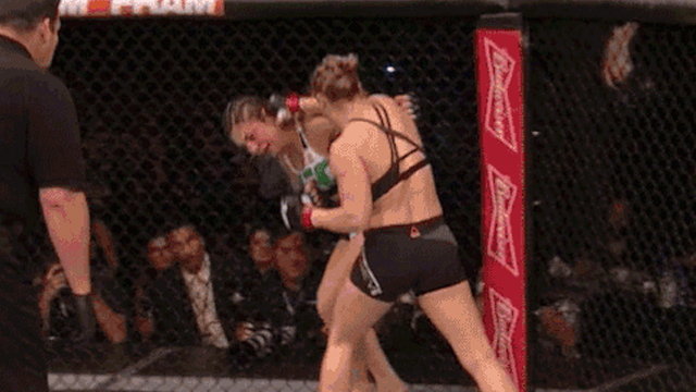 AND STILL UNBEATEN. Ronda Rousey lands a right hand on Bethe Correia's ear en route to a first round knockout. Screenshot from YouTube 