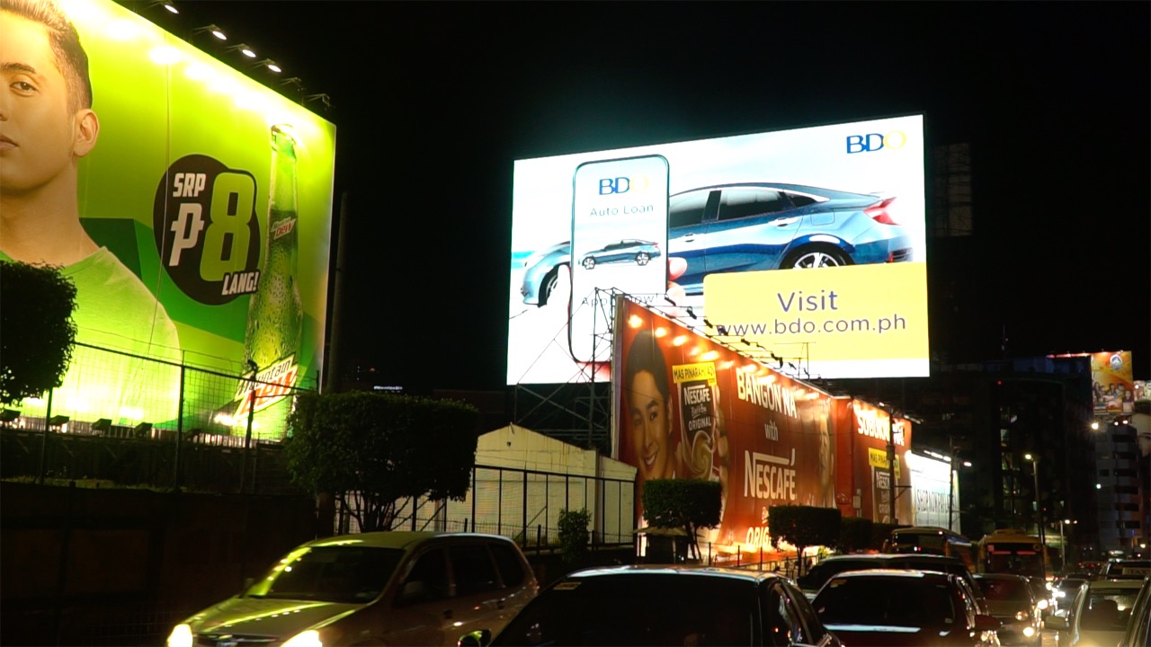 BRIGHT. Huge electronic billboards illuminate EDSA at night. Photo by Naoki Mengua/Rappler 