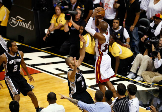 HISTORIC TRIPLE. Ray Allen of the Miami Heat makes a historic game-tying 3-pointer over Tony Parker in the fourth quarter during Game 6 of the 2013 NBA Finals, essentially saving the series and the championship against the San Antonio Spurs. Kevin C. Cox/Getty Images/AFP 