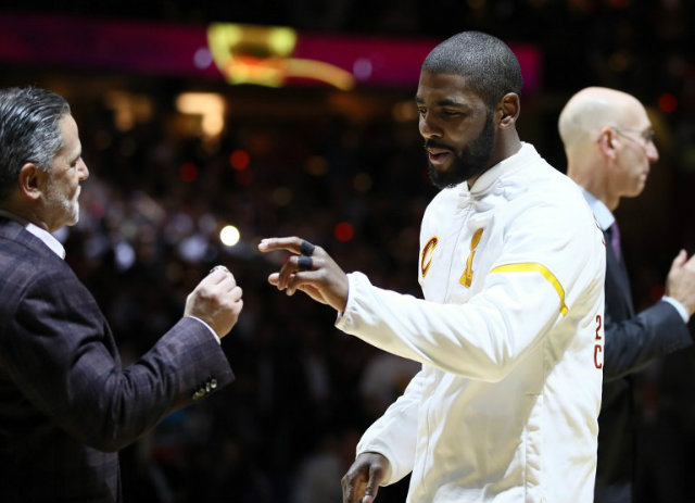 DAGGER. Kyrie Irving, seen here receiving his championship ring from Cleveland Cavaliers owner Dan Gilbert on October 25, nails the dagger 3-pointer against the Toronto Raptors. Ezra Shaw/Getty Images/AFP  