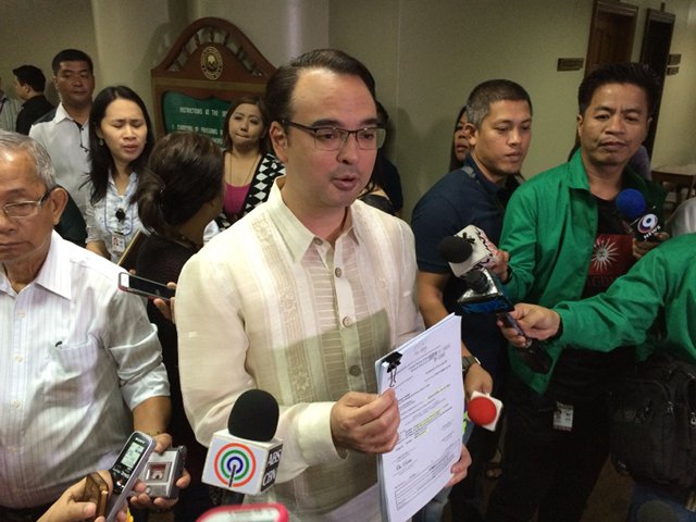 'LIKE ADULTERY.' Senator Alan Peter Cayetano holds up documents that, he says, establish the MILF's ties with Marwan. File photo by Ayee Macaraig/Rappler  