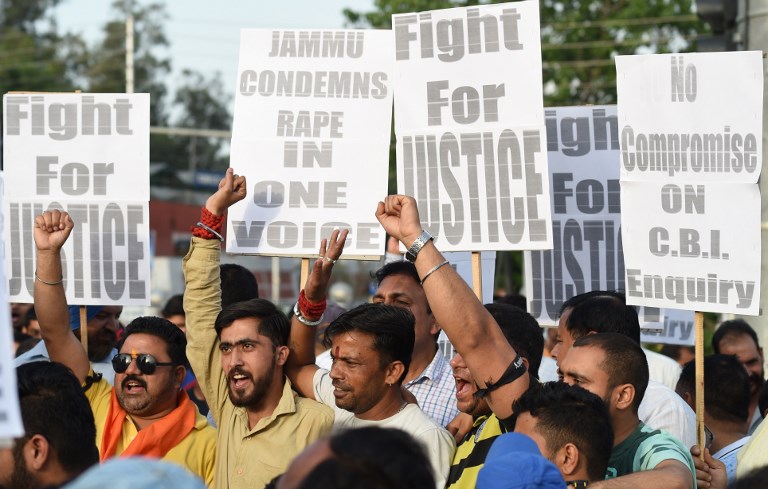 PROTEST. Indian supporters of Bharatiya Janata Party (BJP) leader Chaudhary Lal Singh, who resigned from the state cabinet over the Kathua rape and murder case of an eight-year-old girl, hold placards during a rally. Photo by Sajjad Hussain AFP  