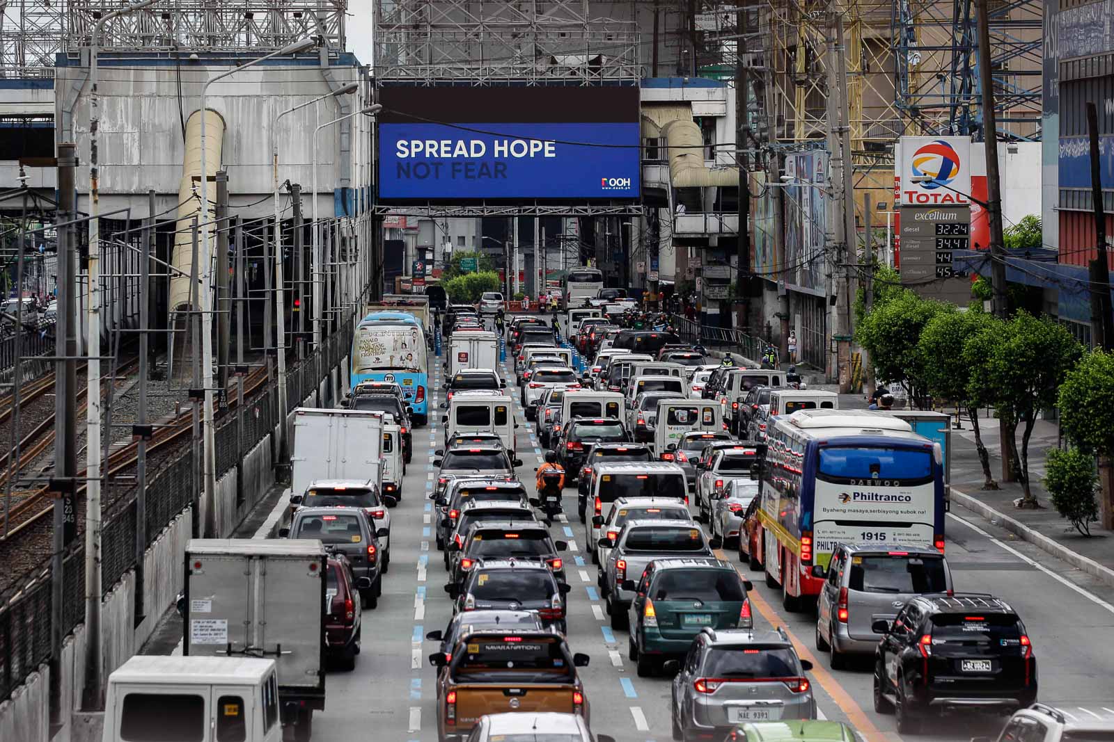 An electronic billboard along EDSA flashes inspirational messages amid the pandemic and telling commuters to travel only for essential needs as NCR starts on MECQ on May 16, 2020. Photo by Czar Dancel/Rappler 