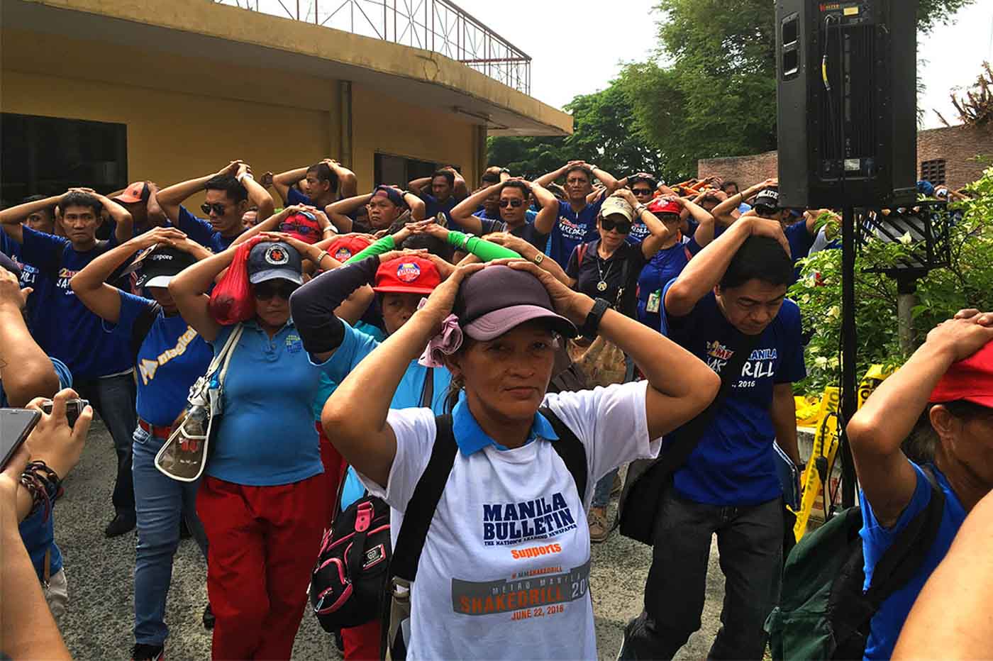 PREPAREDNESS. Metro Manila Shake Drill volunteers and participants walk to the designated safe area after the 7.2-magnitude earthquake simulation. Photo by Katrina Artiage/Rappler  