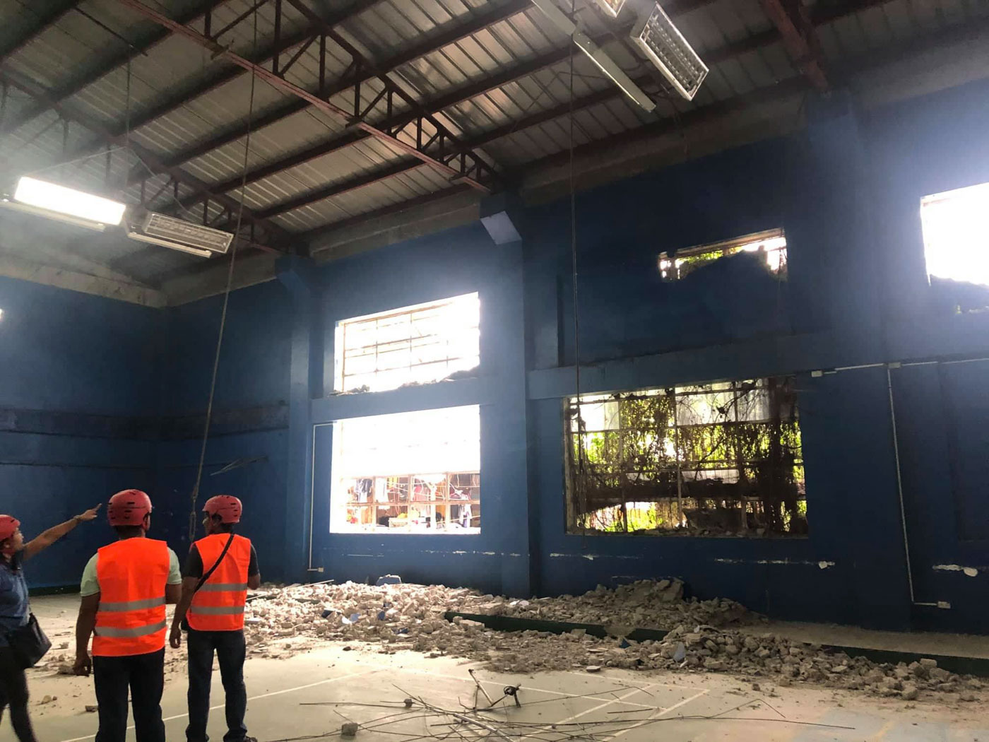 SAFE FOR OCCUPANCY. Even with a collapsed wall, the building was deemed safe for occupancy by the inspection team. Photo from QC DRRMC 