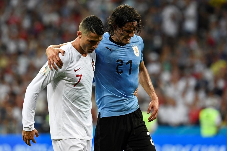 INJURY SCARE. Edinson Cavani had to be helped by Cristiano Ronaldo after suffering an injury late in Uruguay's win over Portugal. Photo by Jonathan Nackstrand/AFP 