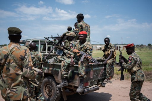 ARMS EMBARGO? Sudan People Liberation Army (SPLA) soldiers stand on a pick up truck on their way to the river side to ride on a boat on the Nile, as they head to Alole, northern South Sudan, on October 16, 2016. File photo by Charles Atiki Lomodong/AFP 