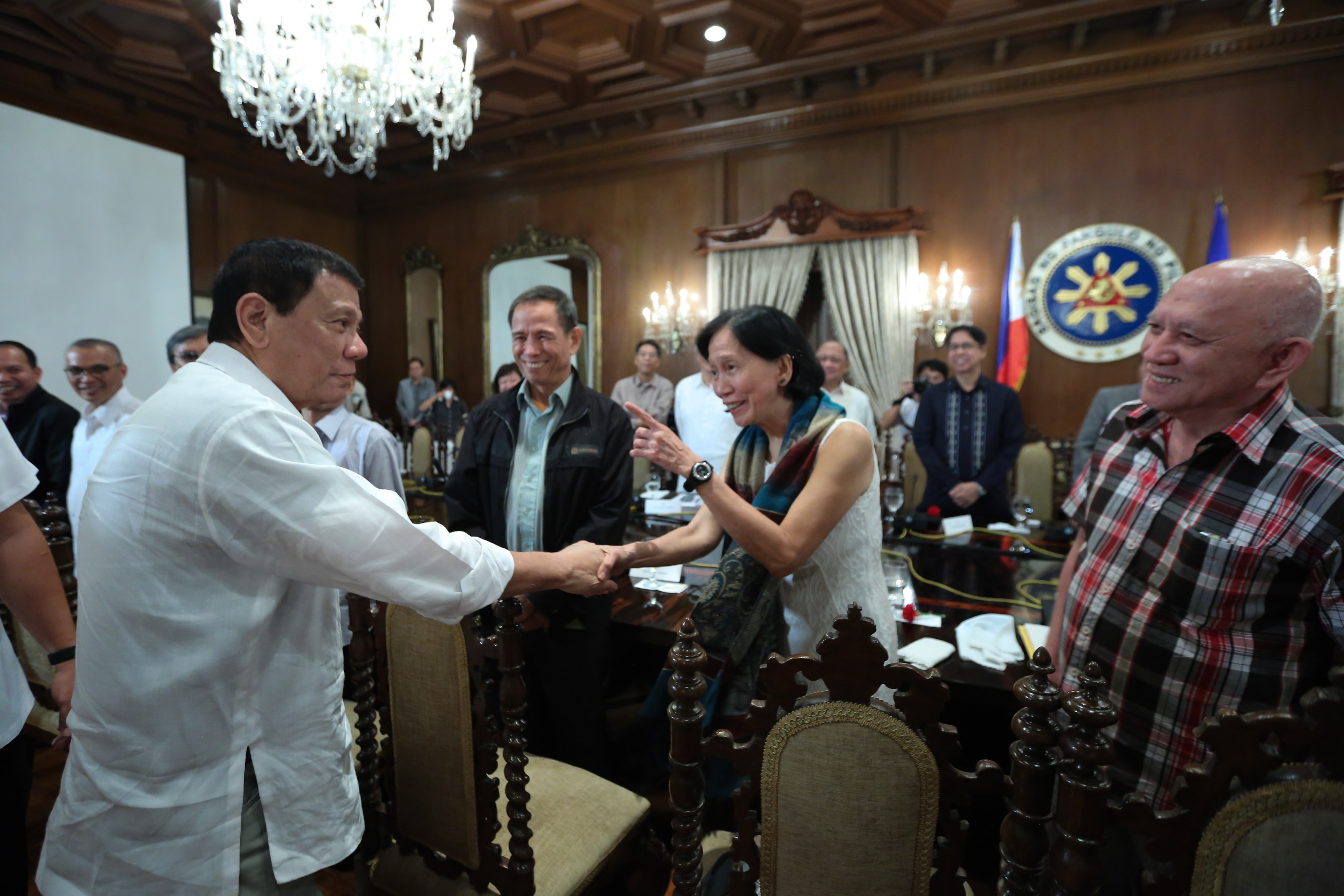 FROM THE PAST. President Rodrigo Duterte shares a light moment with Wilma Tiamzon, chairperson of the Reciprocal Working Group on End of Hostilities and Disposition of Forces (RWG-EHDF) of the National Democratic Front of the Philippines (NDFP), in a meeting held in Malacañang's State Dining Room on September 26. PPD photo 