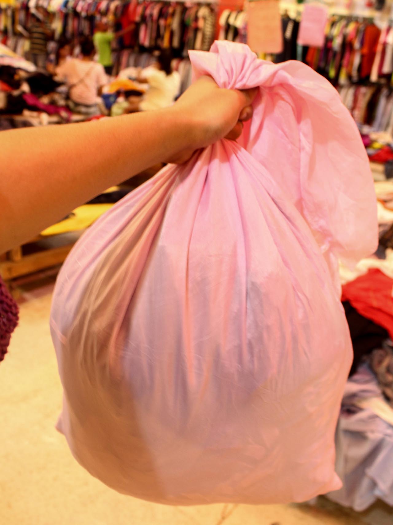NO MORE SANDO BAGS. A local ukay-ukay store uses cloth sacks for purchases. Photo by Claudia Gancayco 