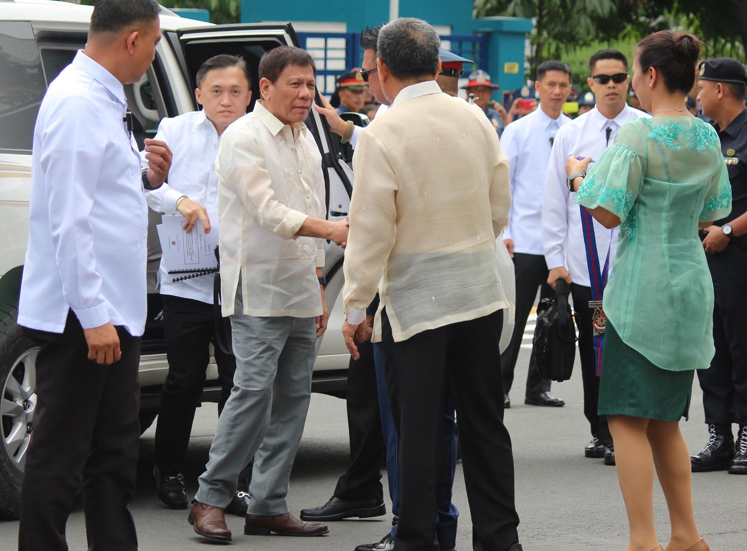 DUTERTE AND AIDE. President Rodrigo Duterte arrives for a PNP ceremony closely followed by his aide Bong Go (man holding documents). File photo by Joel Liporada/Rappler 