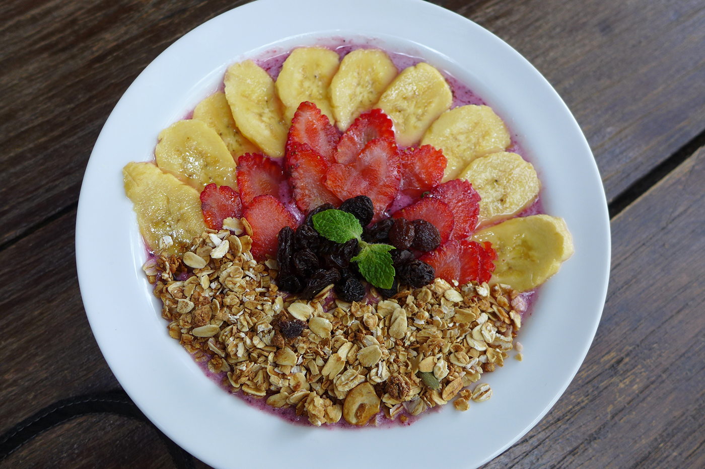 PRETTY AND NUTRITIOUS. The Mixed Berries Smoothie Bowl consists of granola, milk, bananas, raisins and strawberries
 