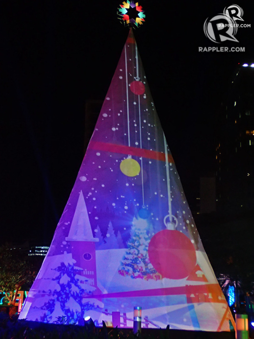 GIANT TREE. At the Sparkle of Christmas show, magical holiday scenes are projected on a 40-foot-tall Christmas tree.  