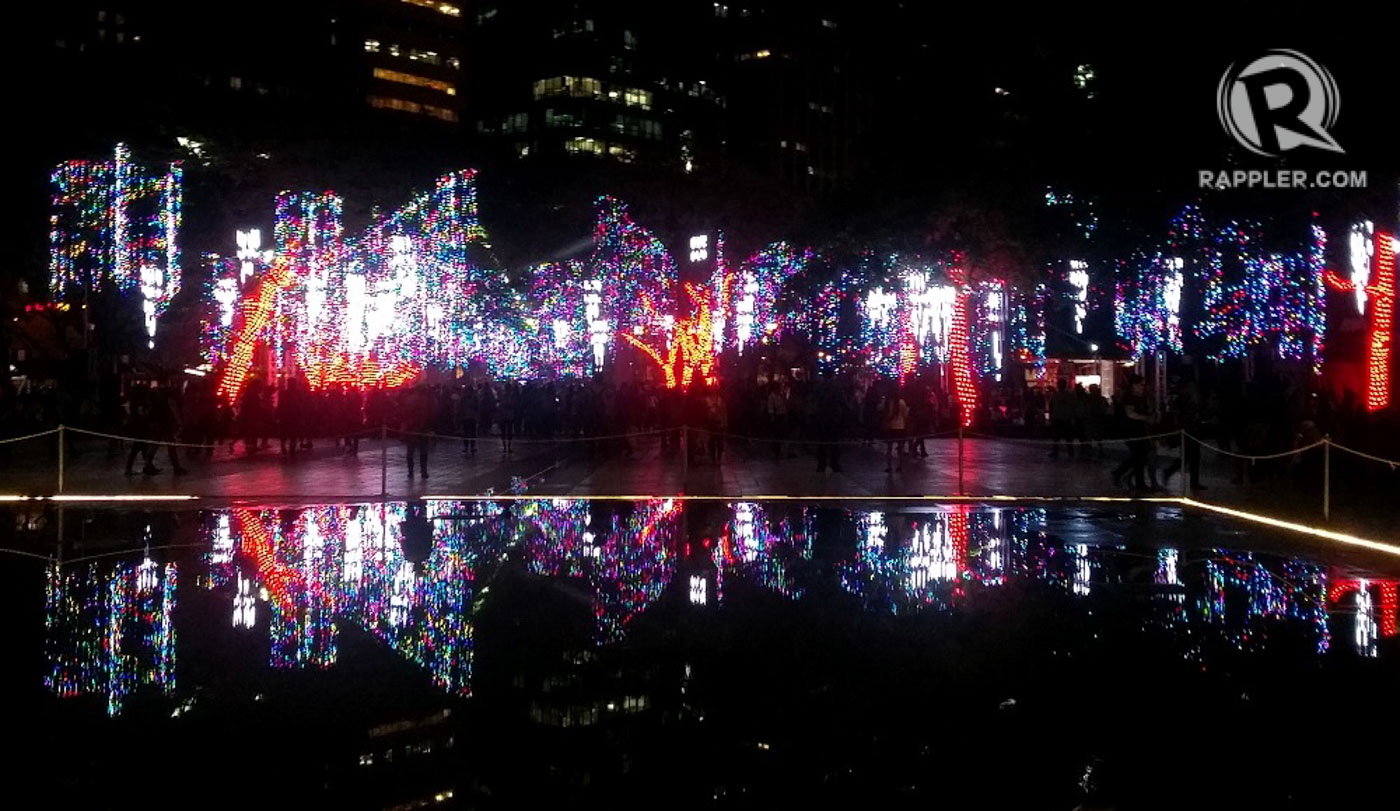 FESTIVAL OF LIGHTS. Lights from Ayala Triangle's classic light and sound show form a beautiful reflection on the park fountain's still waters. Photo by Sharon Rose Baldonado  