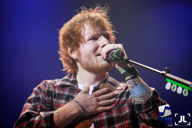 HAND ON HIS HEART. Manila 'found love' with Ed Sheeran as he serenades fans at the MOA Arena on March 12. Photo courtesy of MMI Live  