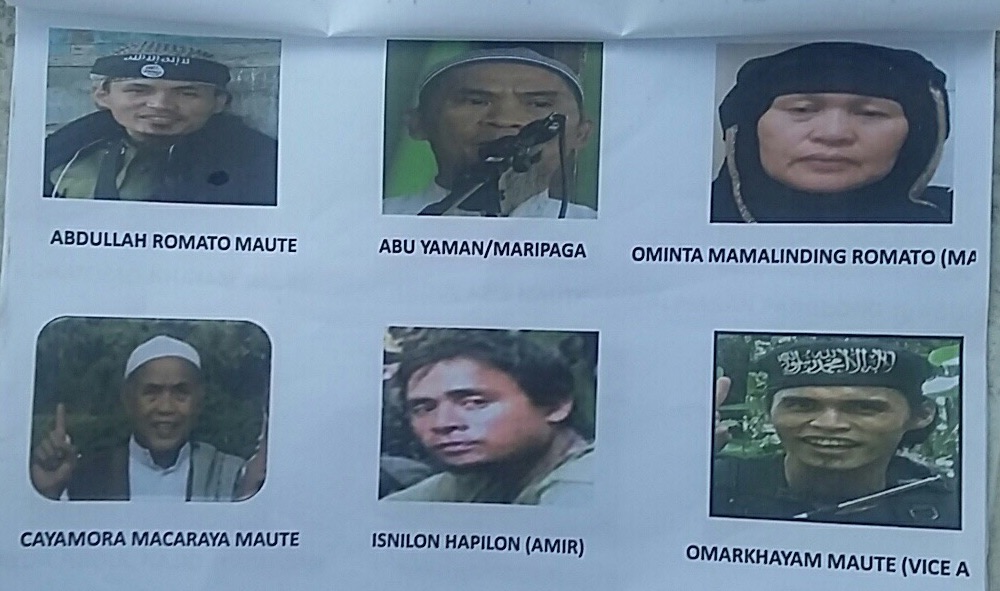 MOST WANTED. These photos of the Mautes are displayed in checkpoints in Lanao provinces. 