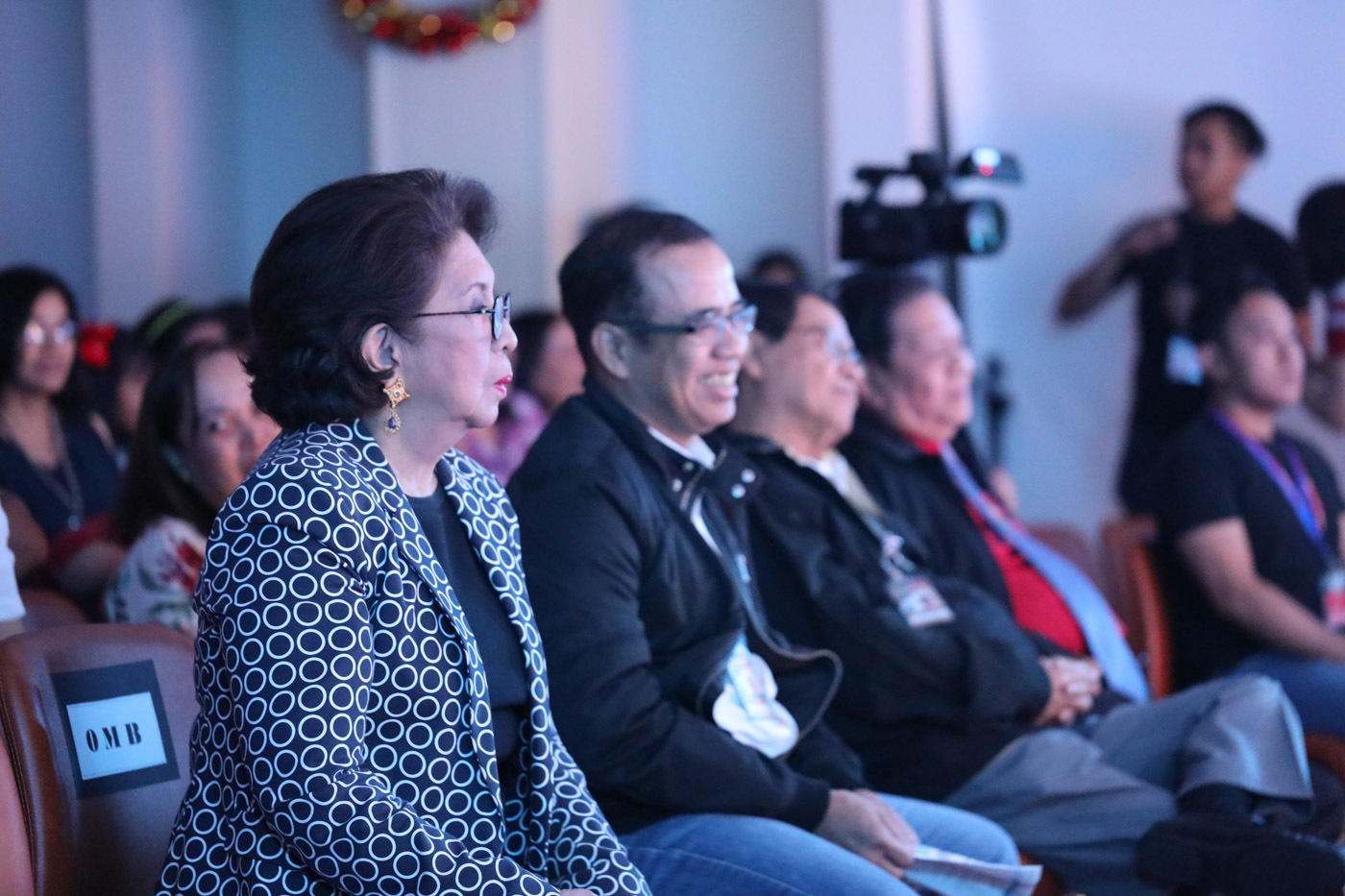 PARTY. Deputy Ombudsman for Luzon Gerard Mosquera smiles while watching the teams dance for the Christmas party. Photo by OMB-PIMRB  