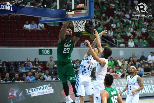PUT BACK. Ben Mbala (L) throws down a slam during the first half of DLSU