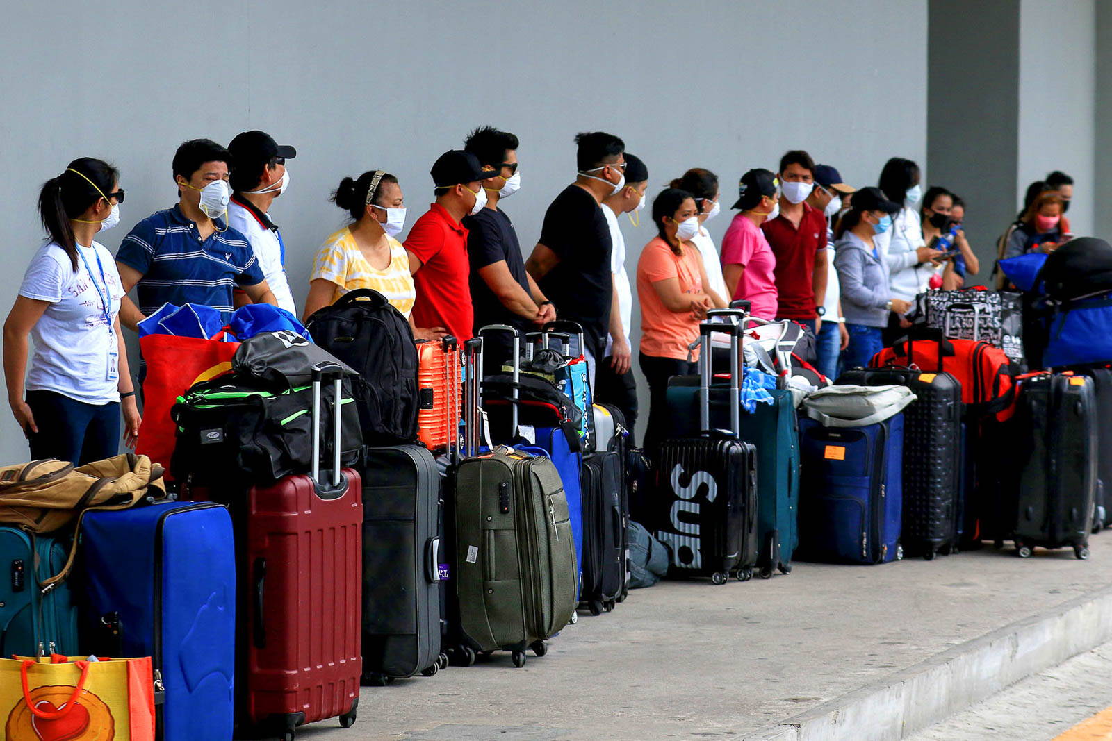 LONG WAIT. It's a long, agonizing journey home for many OFWs stranded in Metro Manila. Here, OFWs wait to get into the PITX terminal in Parañaque City on May 28, 2020. Photo by Inoue Jaena/Rappler    