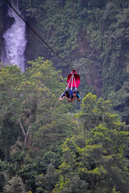 ZIPPING THROUGH THE AIR. Flying through the air with the mountains and waterfalls beneath us. Photo by Joshua Berida 