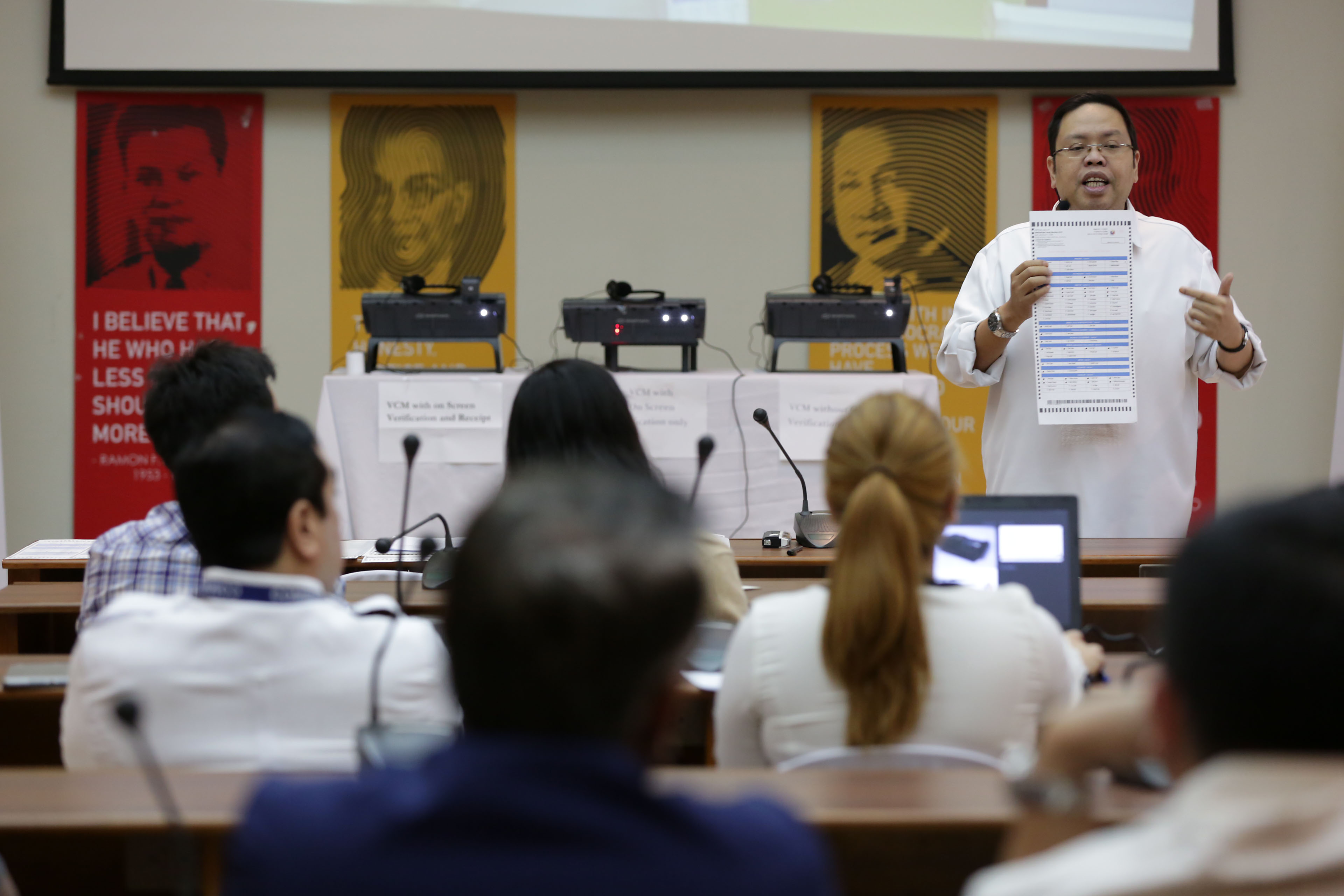 COMELEC DEMO. Comelec Spokesperson James Jimenez shows the use of vote-counting machines on January 25, 2016, before members of the media and election watchdogs. Photo by Ben Nabong/Rappler  
