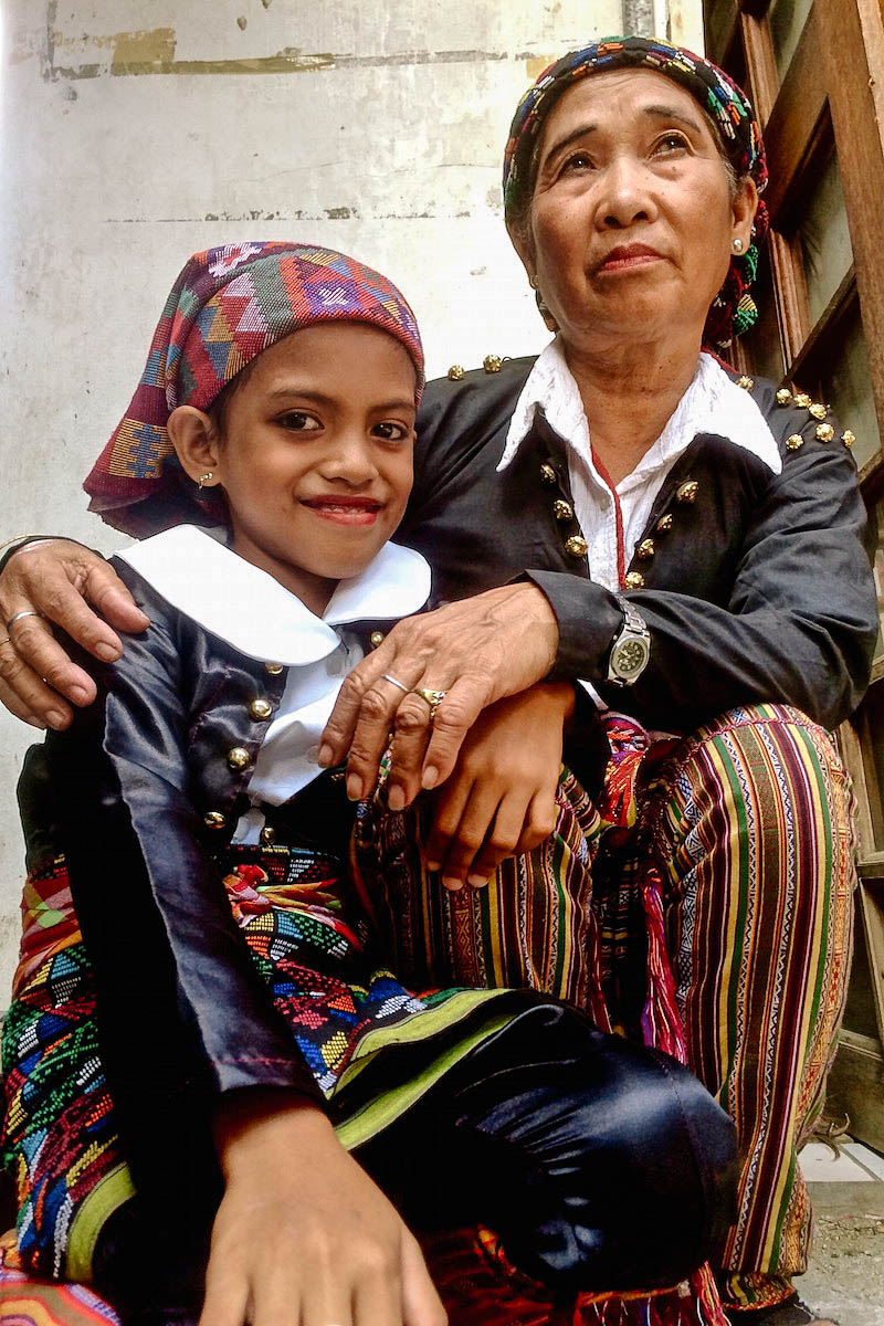 Yakan grandmother and daughter take a rest and enjoy the ceremony 