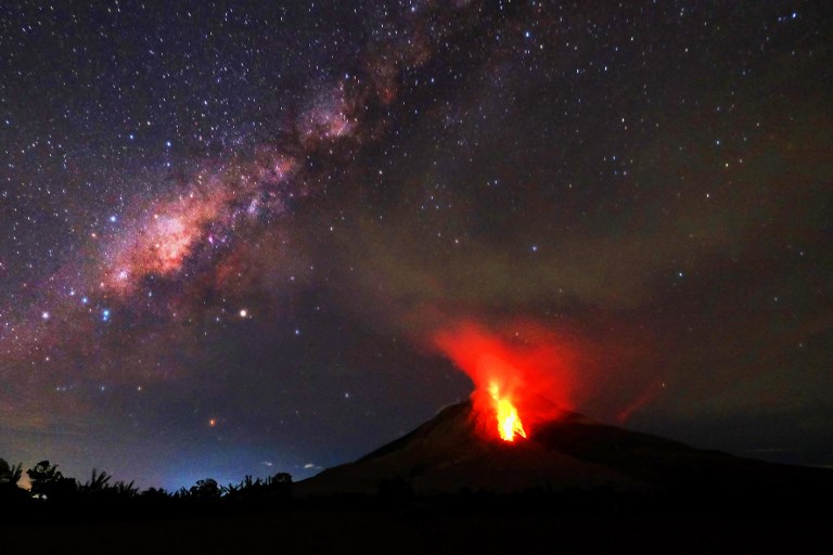 ERUPTION. Hot lava flows down the Mount Sinabung volcano in the night in Karo, North Sumatra, Indonesia on July 30, 2017. Photo by Tibta Pangin/AFP  
