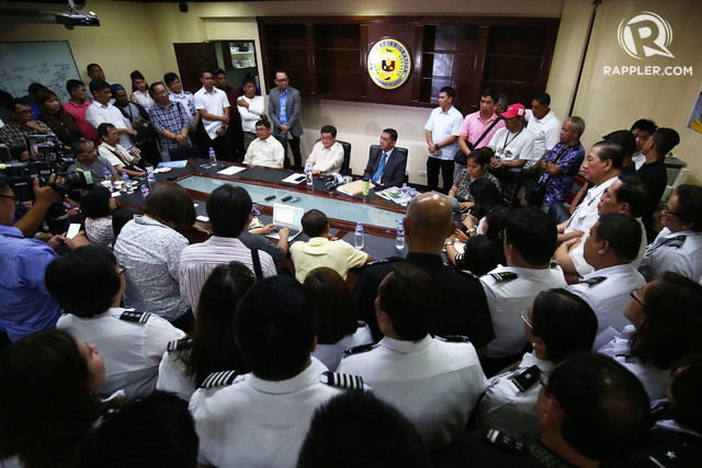 IMMIGRATION DEPARTMENT. Newly-installed Bureau of Immigration (BI) Commissioner Jaime Morente address the BI officers and members of the media during a short and informal turnover at their office in Intramuros on July 1. With Morente are outgoing BI commissioner Ronaldo Geron and DOJ secretary Vitaliano Aguirre II. Photo by Ben Nabong/Rappler   