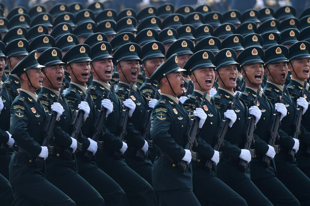 MUSCLE. File photo of Chinese troops marching during a military parade in Tiananmen Square in Beijing on October 1, 2019, to mark the 70th anniversary of the founding of the People's Republic of China. Photo by Greg Baker/AFP 