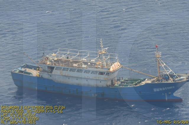 CONTESTED WATERS. A Chinese vessel is shown near the Scarborough Shoal in this surveillance photo by the Philippine Department of National Defense. Photo posted by Agriculture Secretary Manny Piñol on Facebook 