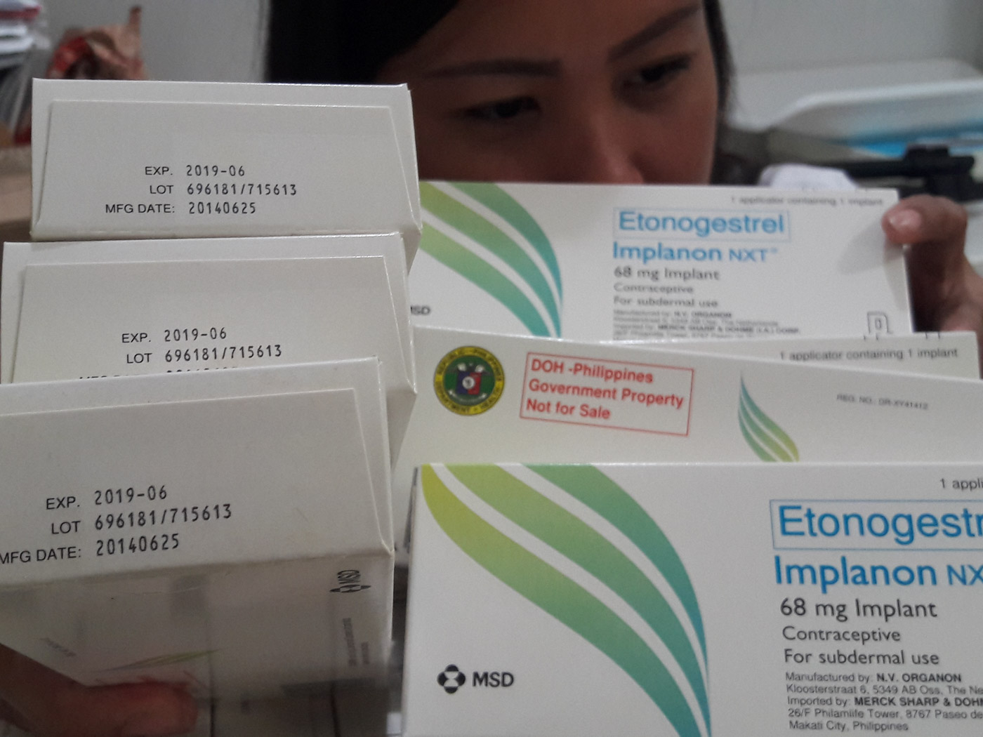 NON-ABORTIFACIENTS. A nurse in a clinic in Tabaco, Albay, shows boxes of Implanon that are nearing expiration. Photo by Mau Victa/Rappler 
