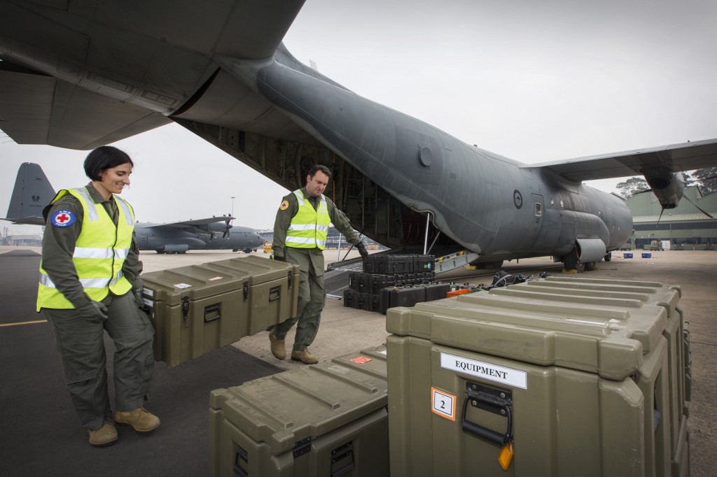 PREPARATIONS. This handout photo taken and released by the Royal Australian Air Force on December 11, 2019 shows Flight Lieutenant Danielle Polgar (left) and Squadron Leader Shamus Shepherd from No. 3 Aeromedical Evacuation Squadron preparing medical equipment to load onto a C-130J Hercules prior to a mission to repatriate Australians injured from the White Island volcanic eruption, at the Royal Airforce Base in Richmond. Handout photo by Royal Australian Air Force/AFP/XGTY 