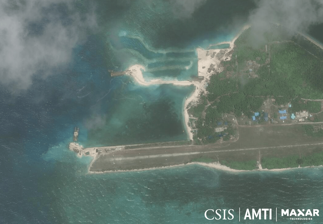 DREDGING. This image from June 2019 shows two barges doing dredging work on Pag-asa Island. One is repairing a sunken portion of the airstrip, while the other appears to be building a beaching ramp. Photo from AMTI-CSIS  