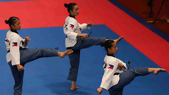 GOOD START. The Philippine taekwondo poomsae team gets the country's campaign going by capturing two bronze medals. Photo from Asian Games media bureau  