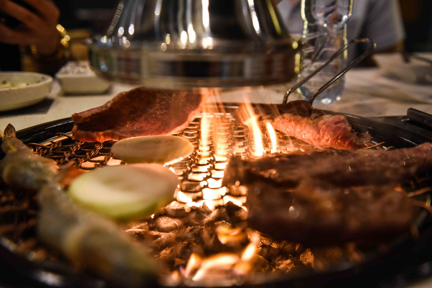 GET LIT. The K-BBQ experience involves being face-to-face with a hot grill. 