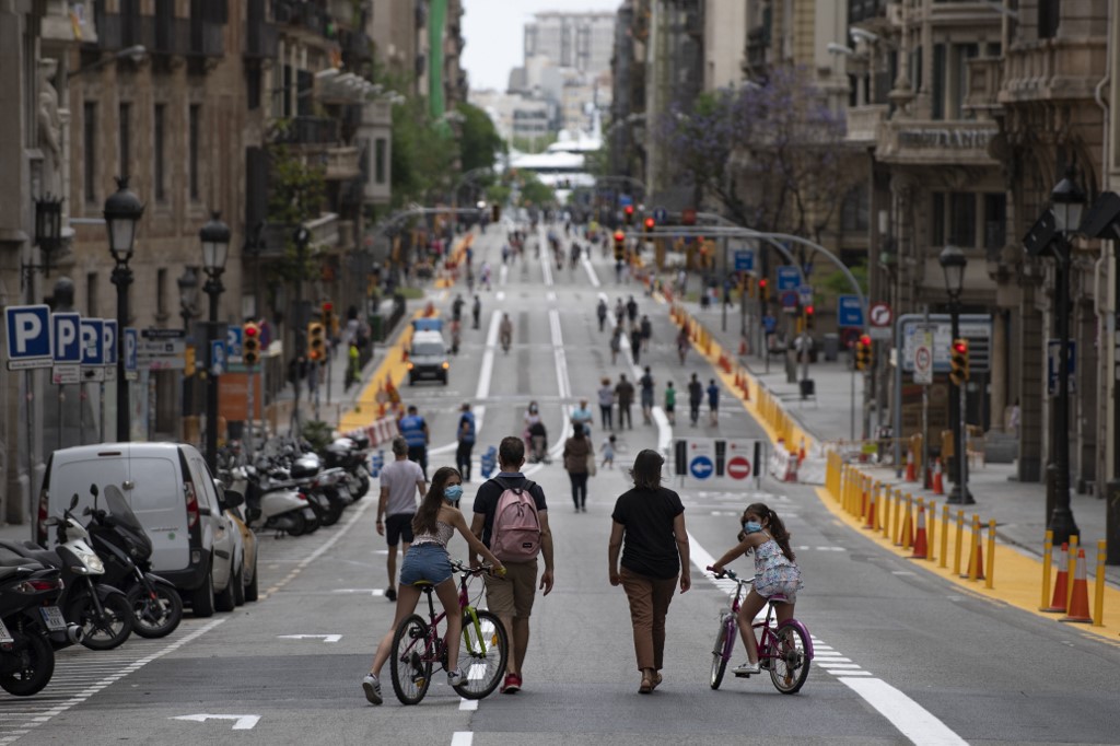 LOCKDOWN LOOSENED. People walk on a road turned into a pedestrian street on weekends in Barcelona, Spain, on May 24, 2020. Photo by Josep Lago/AFP 
