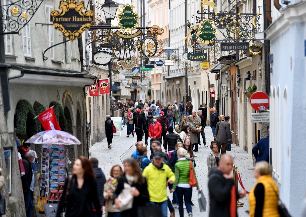 CROWD. People walk in the shopping street 'Getreidegasse' in the old town in Salzburg, Austria on May 2, 2020. Photo by Barbara Gindl/AFP 