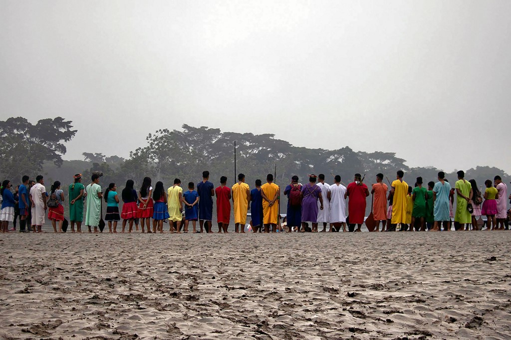 RIVER. Members of the Siekopai indigenous nation stand along the banks of the Aguarico River in the community of Waiya in Ecuador, on April 16, 2020 during the novel coronavirus pandemic. Photo by Amazon Frontline/AFP 