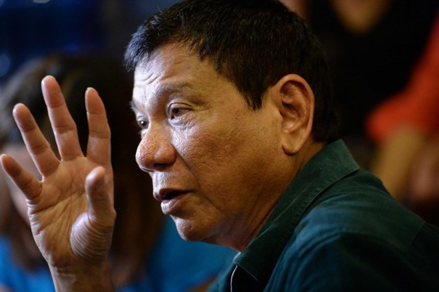 FACING THE MEDIA. President-elect Rodrigo Duterte speaks to the media for the first time since he claimed victory in the presidential election, at a restaurant in Davao City, on the southern island of Mindanao on May 15, 2016. Ted Aljibe/AFP 