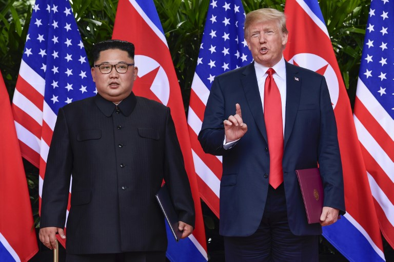 TRUMP-KIM SUMMIT. US President Donald Trump makes a statement before saying goodbye to North Korea leader Kim Jong Un (L) after their meetings at the Capella resort on Sentosa Island in Singapore on June 12, 2018. Photo by Susan Walsh/AFP 