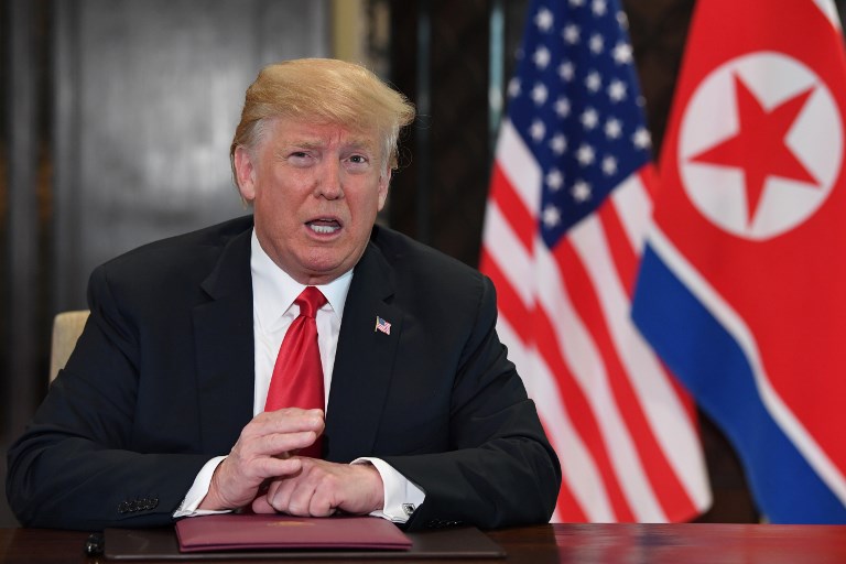 HISTORIC. US President Donald Trump speaks at a signing ceremony with North Korea's leader Kim Jong-un (not pictured) during their historic US-North Korea summit, at the Capella Hotel on Sentosa island in Singapore on June 12, 2018. File photo by Saul Loeb/AFP  