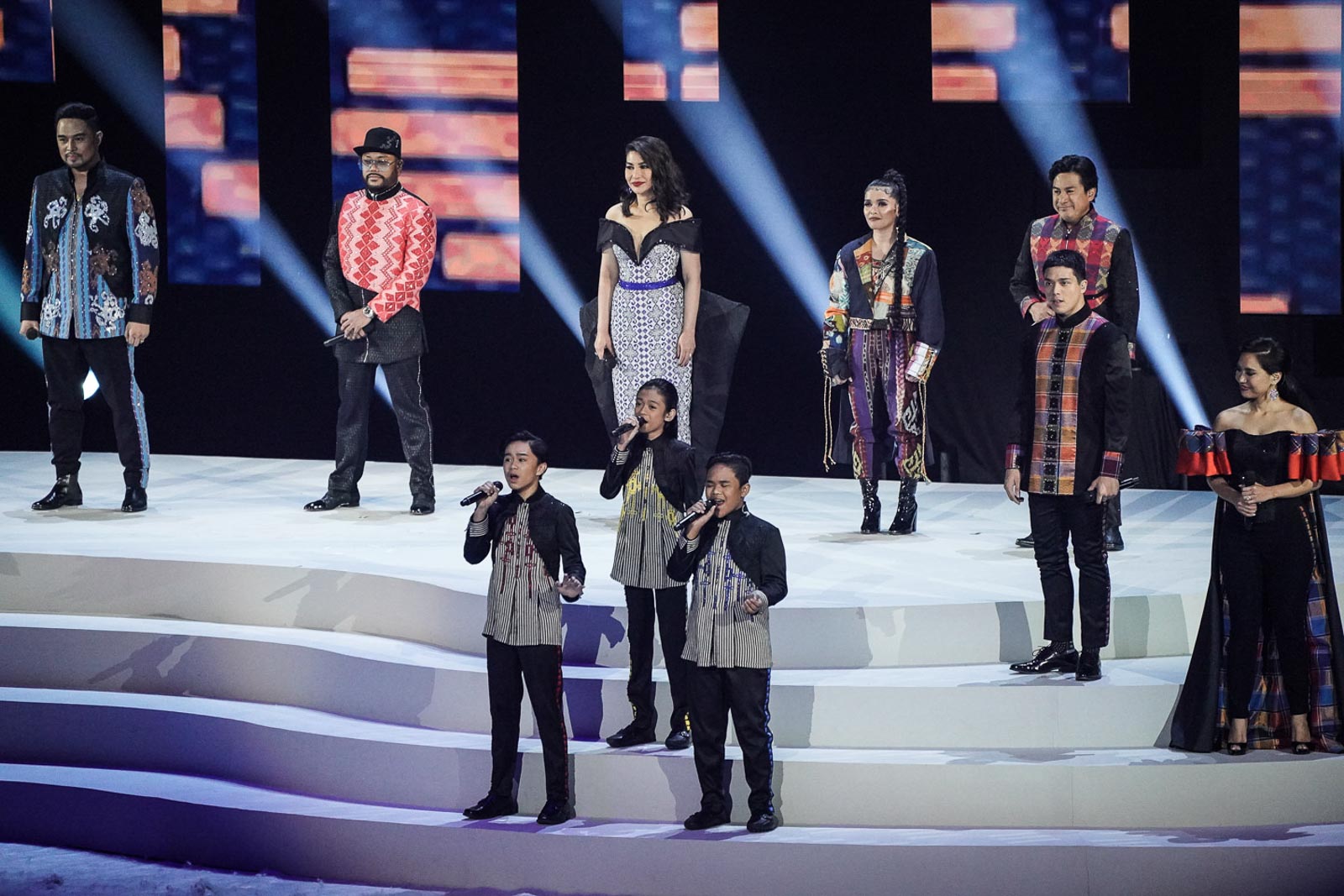 WIN AS ONE. Filipino singers including Jed Madela, Apl.de.ap, Lani Misalucha, the TNT Boys, KZ Tandingan, Robert Seña, Elmo Magalona, and Aicelle Santos come together to sing the SEA Games 2019 official song 'We Win As One' at the opening ceremonies. Photo by Josh Albelda/Rappler 