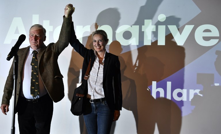 'ALTERNATIVE' Top candidate of the Alternative for Germany (AfD) Alexander Gauland (L) and top candidate of the Alternative for Germany (AfD) Alice Weidel celebrate on stage during an election night event in Berlin during the general election on September 24, 2017.
The Alternative for Germany (AfD) became the first hard-right, openly anti-immigration party to enter parliament in force since World War II. John Macdougal/AFP 