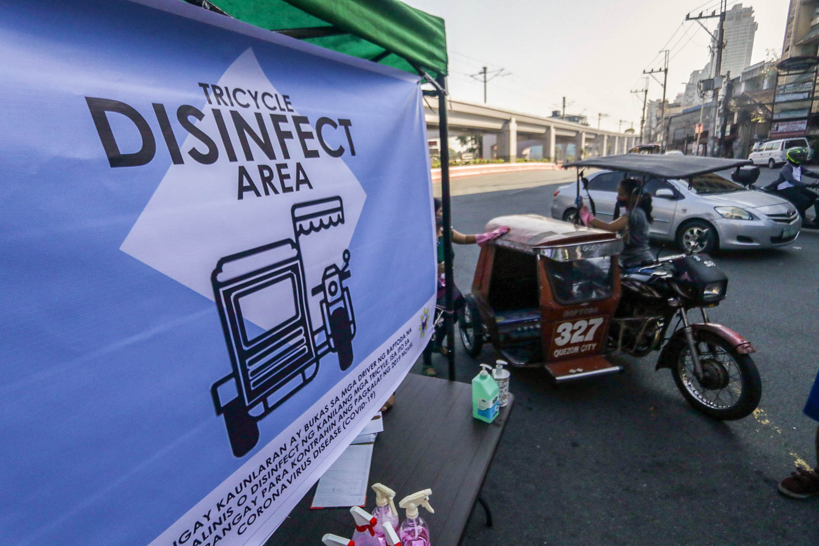 CORONAVIRUS. Officials of Brgy. Kaunlaran in Quezon City disinfects tricycles as a precautionary measure against the spread of COVID-19. Photo by KD Madrilejos/Rappler 