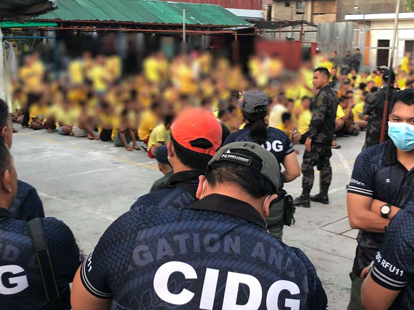 OPLAN GALUGAD. Jail inmates herded outside their cells during early morning raid Saturday at the Davao City Jail in Barangay Ma-a in Davao City. Photo courtesy of DCPO 