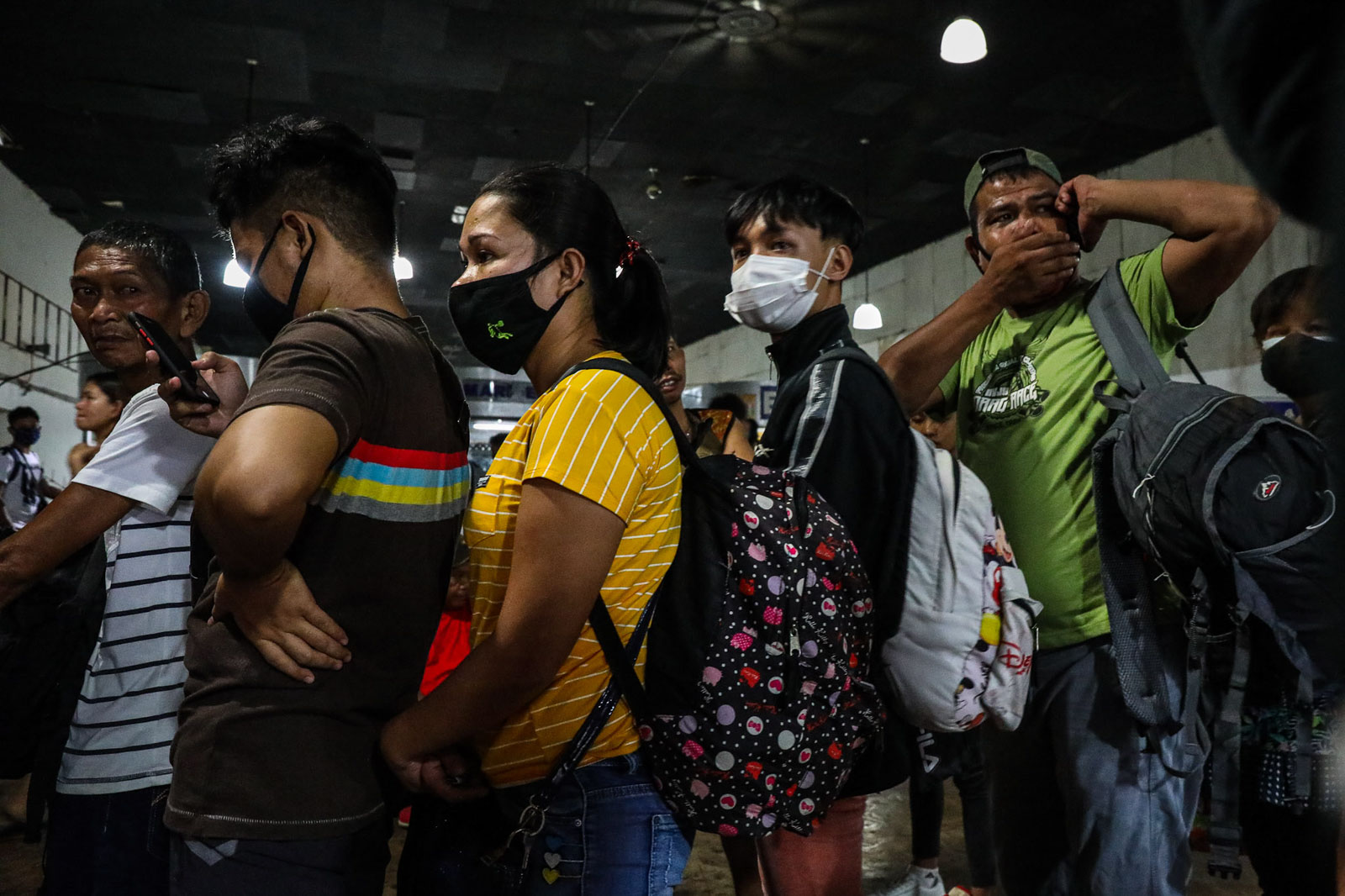TRACING PATIENTS. Thousands of commuters crowd the Araneta Center Bus Terminal in Quezon City on March 13, 2020, in a frantic rush to leave Manila to avoid the travel ban ahead of the lockdown. Photo by Jire Carreon/Rappler 